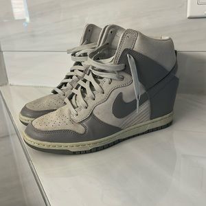 Grey Nike high tops with a sneaky heel in the back